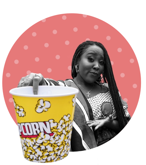 Filmmaker holding a large bucket of popcorn